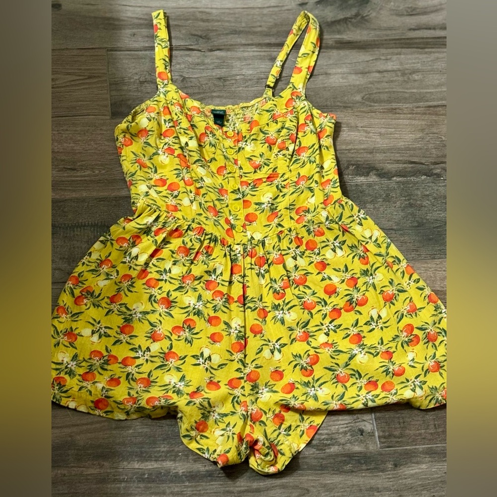 Yellow Floral Romper with Orange Accents